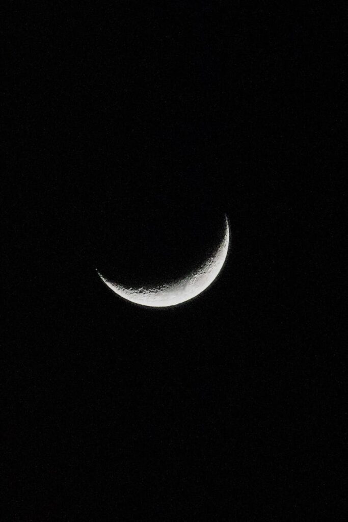 captivating crescent moon against black sky