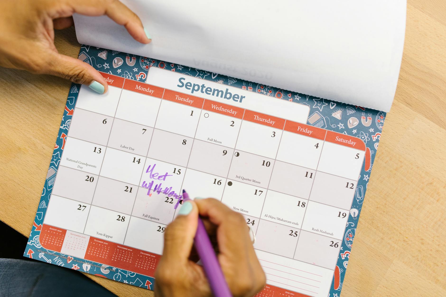 person marking his calendar