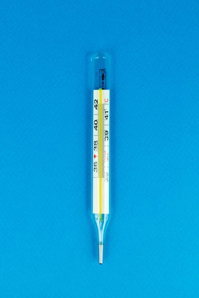 a thermometer on a blue surface