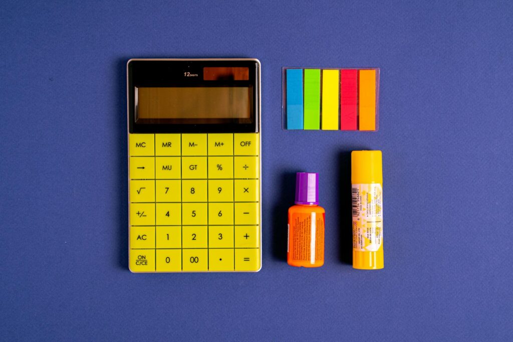 yellow and black calculator on blue background